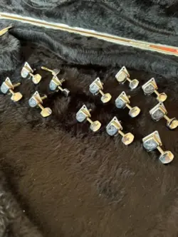 TWO SETS OF VINTAGE FENDER “F” STYLE GUITAR TUNING PEGS