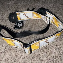 FENDER MONOGRAMMED GUITAR STRAP WITH LEATHER ENDS, WHITE/BROWN/YELLOW