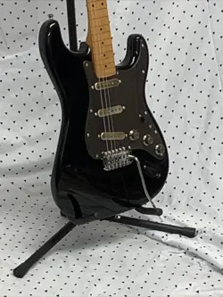 BLACK ELECTRIC GUITAR ASSEMBLED FROM MOSTLY FENDER PARTS.  ST STYLE