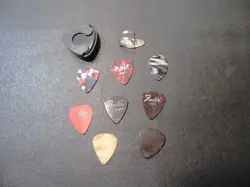 LOT OF 10 VINTAGE GUITAR PICKS WITH ONE VINTAGE PICK HOLDER
