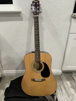 DREADNOUGHT ACOUSTIC GUITAR.