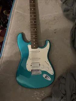 LIGHT BLUE ELECTRIC GUITAR
