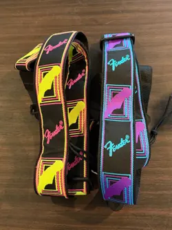 TWO NEON MONOGRAM FENDER GUITAR STRAPS (NEW)