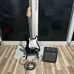 BLACK AND WHITE DNKYER GUITAR, FENDER AMP, FENDER CABLE, SHIPPED AFTER JAN 28