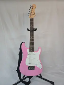 FENDER SQUIER MINI PINK STRATOCASTER ELECTRIC GUITAR WITH FENDER CASE