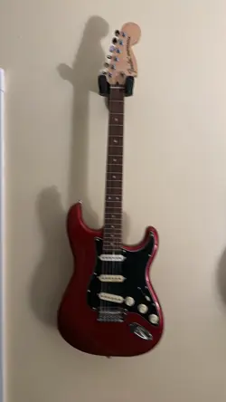 MIM FENDER STRATOCASTER GUITAR. SSS PICKUPS. BURGUNDY RED.