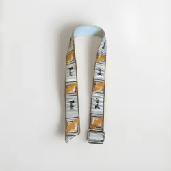 FENDER VINTAGE MONOGRAMMED GUITAR STRAP (WHITE/BROWN/YELLOW) BELT