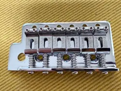 LEFT-HANDED LEFTY TREMOLO PLATE & STAMPED SADDLES MEXI FENDER STRATOCASTER