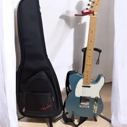 FENDER ELECTRIC GUITAR BLUE WITH CASE - USED, 1 YEAR OLD