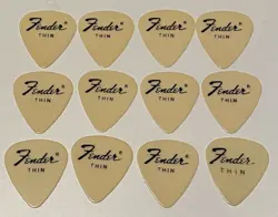 VINTAGE GUITAR PICKS-1970’S FENDER 351-THIN GAUGE-CREAMCOLOR CELLULOID-LOT OF 12
