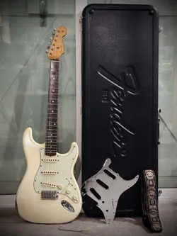 STRAP AND PICKGUARD.