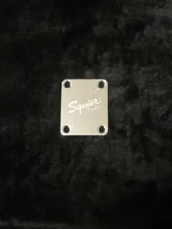 SQUIER LOGO NECK PLATE CHROME - USED