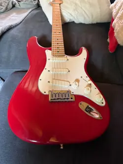 LATE 1980S RED FENDER STRAT PLUS GUITAR. EXCELLENT CONDITION.