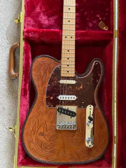 BROWN LEATHER COVERED