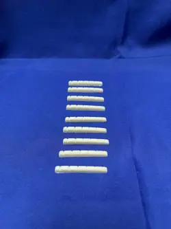 9 SLOTTED PLASTIC FLAT-BOTTOMED NUTS FOR IMPORT FENDER STRAT STYLE ELEC GUITAR