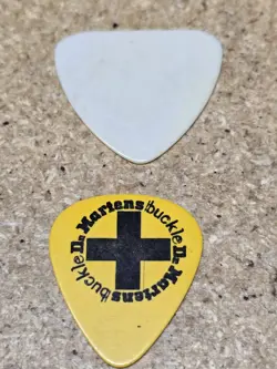 VINTAGE FENDER DR. MARTINS GUITAR PICK AND 1 UNIDENTIFIED PICK