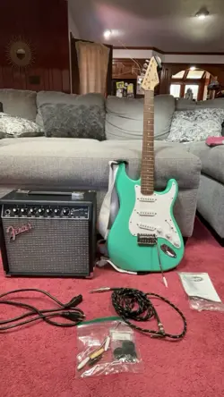SQUIER BULLETT STRATOCASTER SEAFOAM GREEN WITH FENDER CHAMPION 20 AMPLIFIER.