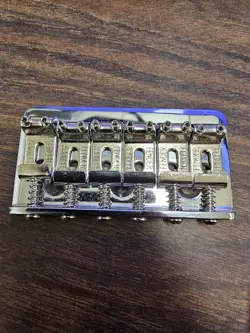 GENUINE FENDER TELECASTER/TELE OR STRATOCASTER/STRAT HARDTAIL BRIDGE, CHROME