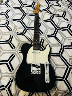 SX ELECTRIC GUITAR TELECASTER. USED ONLY 2X. COMES WITH A FREE FENDER CASE.