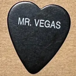VINTAGE 1990'S MR VEGAS FENDER HEAVY GUITAR PICK IN HEART-SHAPED BLACK