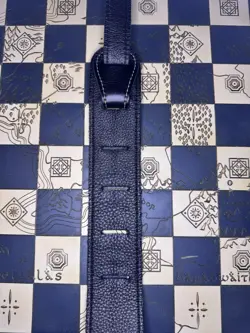 BROKEN-IN LEATHER GUITAR