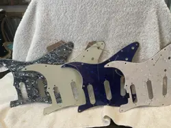 FOUR FENDER STRATOCASTER PICK GUARDS.