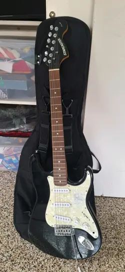 FENDER  ELECTRIC GUITAR WITH STAND & CASE