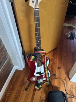 RED FENDER SQUIRE BASS GUITAR. USED.