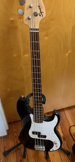 BLACK FENDER SQUIER BASS GUITAR.