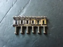 SET OF SIX GENUINE FENDER STRATOCASTER SADDLES FOR 52.5MM STRING SPACING