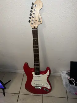 FENDER ELECTRIC GUITAR ,MISSING ONE STRING BEAUTIFUL GUITAR COLOR RED