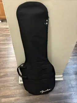 BLACK FENDER GUITAR AND GIG BAG.  NEED TO SALE THIS WEEK