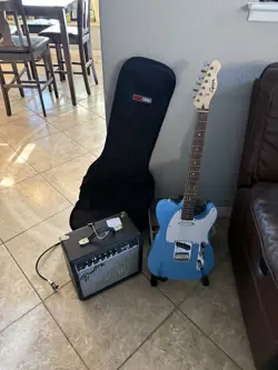 SQUIER SONIC TELECASTER ELECTRIC GUITAR W/ FENDER AMP AND ACCESSORIES ?