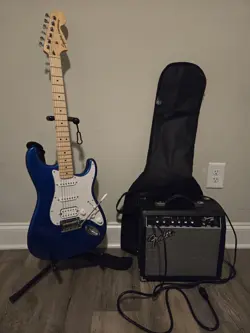 INCLUDES GUITAR STAND