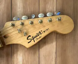 SQUIER BY FENDER MINI STRATOCASTER ELECTRIC GUITAR WITH FENDER STRAP