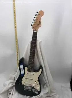 SIX-STRING MUSICAL INSTRUMENT