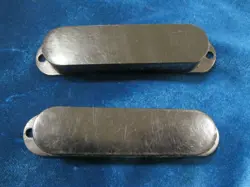 TWO VINTAGE 1960'S FENDER MUSTANG DUOSONIC OR MUSICMASTER PICKUP COVERS