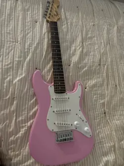 SQUIER BY FENDER MINI ELECTRIC PINK GUITAR