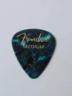GUITAR PICK. GOLD