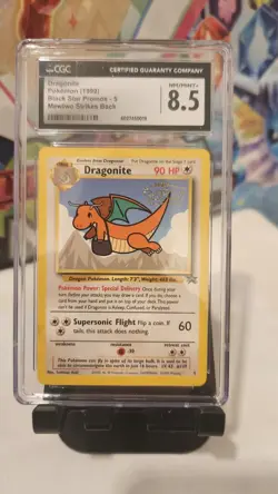 CGC 8.5 - 1999 Dragonite # 5 WB Movie WOTC Black Star PROMO Pokemon Card - Image 1