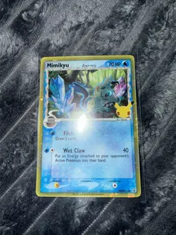 Pokemon TCG Card Celebrations Mimikyu Delta Species SWSH136 Black Star Promo NM - Image 1