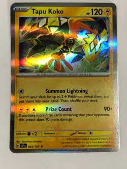 Pokemon TCG Surging Sparks Hologrpahic Error Tapu Koko 065/191Near Mint - Image 1