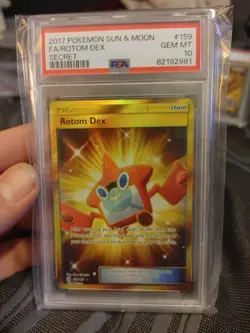 2017 Pokemon Sun & Moon Rotom Dex Full Art Gold Secret Rare 159/149 PSA 10 - Image 1