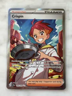 PokÃ©mon TCG Crispin Trainer Card 164/142 Secret Full Art Stellar Crown - Image 1