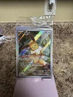 Pokemon TCG Evee 173 Prismatic Evolutions ETB Promo Card Sealed - Image 1