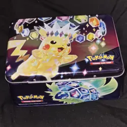 surging sparks pokémon lunchbox Tin W/ Cards, Holos, Bulk, & Small Mini Binder - Image 1