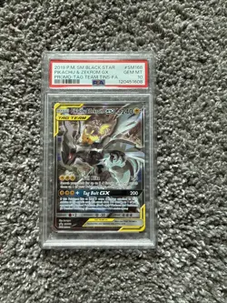 Pokemon PSA 10 SM168 Pikachu and Zekrom GX Black Star Promo Tag Team Tin - Image 1