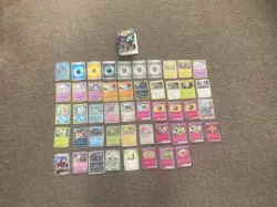 48 Pokemon Cards in English (includes duplicates) & Empty Card Holder Album - Image 1