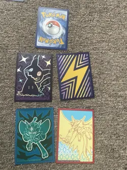 48 Pokemon Cards in English (includes duplicates) & Empty Card Holder Album - Image 8