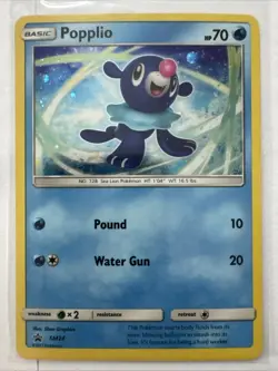 2017 Sun & Moon Promos Popplio SM24 Cosmos Holo Pokemon Card - Image 3